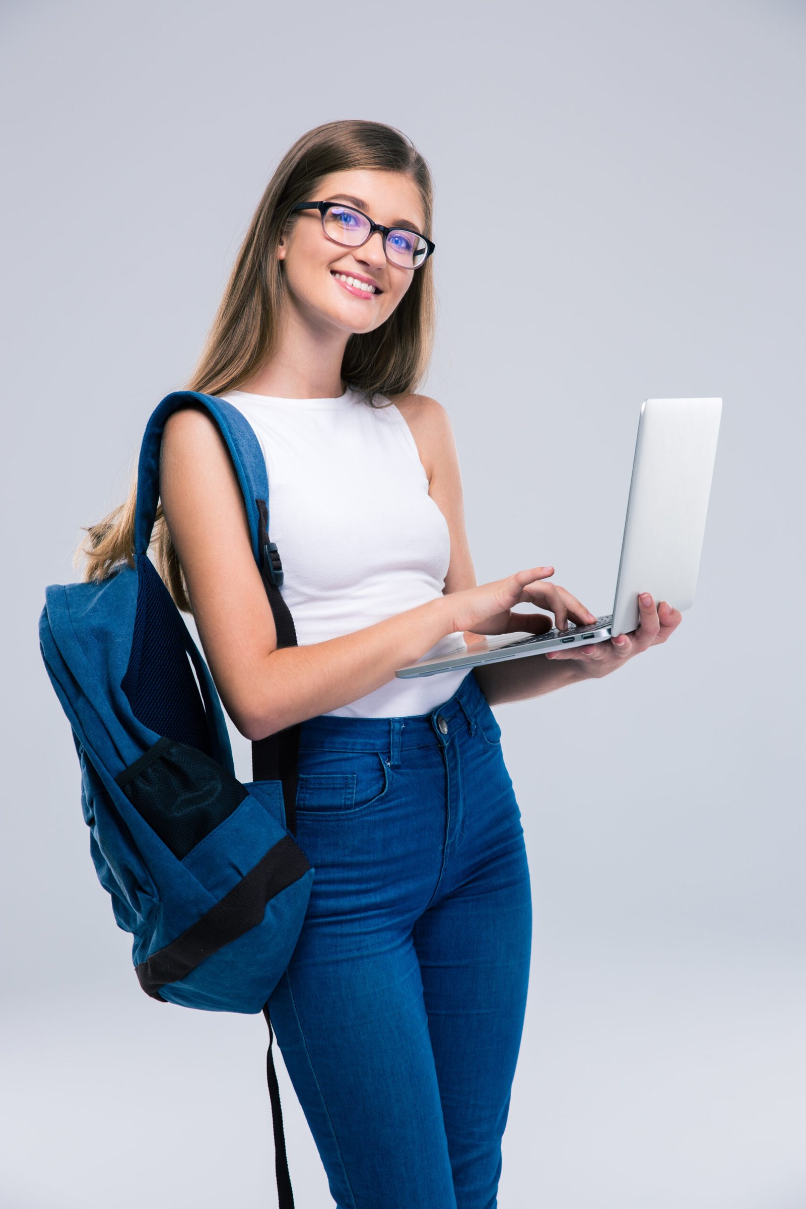 Portrait,Of,A,Happy,Female,Teenager,Using,Laptop,Isolated,On